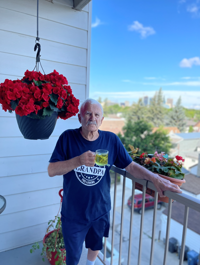 Richard Dorge on his balcony drink Moringa herbal Tea from BioTEI Inc. He says he loves the tea and would recommend this to any body as it has helped him a lot. 